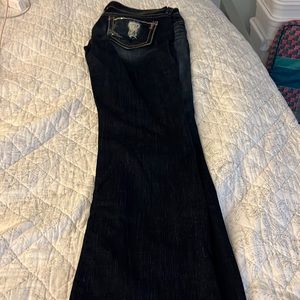 Buckle Virgo bootcut size 32R, darker wash. Some bling on back pockets. Preworn.